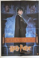 Full view of folded promotional poster showing Harry Potter character artwork and film logo