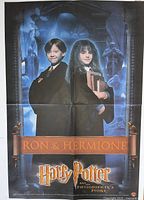 Front view of folded poster showing Ron & Hermione and film logo