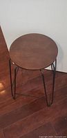Stool top view round wooden seat with metal base