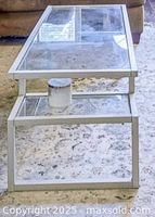 Top and side view of glass coffee table showing chrome frame and upper glass surface