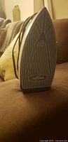 Rowenta steam iron soleplate showing striped pattern and logo