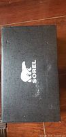 Sorel branded shoe box top