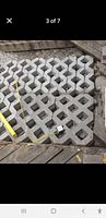 Close view of lattice pavers with measuring tape and box for scale