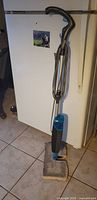 Full view of Bissell Steam Mop Select showing handle, cord and pad