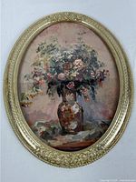 Front view of oval framed floral print