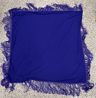 Full view of square purple shawl displaying fringe all around
