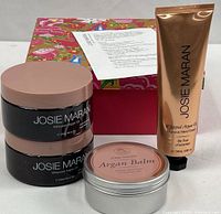 Full lot showing two body-butter jars, balm tin, hand-cream tube, decorative box