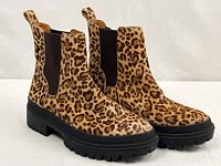 Full view of both boots showing uppers, soles and pattern