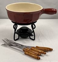 Complete fondue set showing pot on stand with fuel holder and six forks