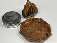 Overall lot showing cabin plate, trout tin, coasters in rack