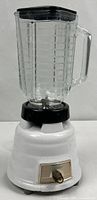 Full view of Osterizer blender with glass jar and lid