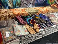 Overall lot showing tapestries, sandals, hats, bags, bandanas and wallets