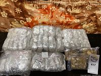 Bulk packaged belts and necklaces in clear bags