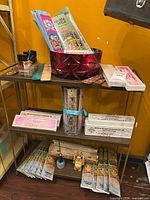 Shelf with incense boxes, burners, oils, bowl