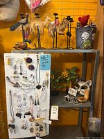 Overall lot showing jewellery board, candle holder and wooden ornaments