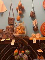 Overall view showing hanging and boxed maracas of various finishes