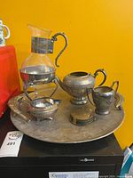 Group shot of all silver-plated items on tray