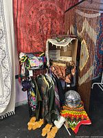 Overall lot showing tapestries, door curtain, clothing rack, sandals, disco ball, purse, incense boxes