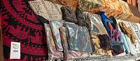 Overview showing tapestries, purses, wallets, bandanas and sandals