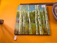 Front view of larger square birch tree transfer print on yellow wall