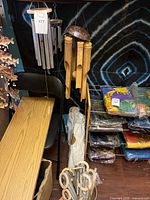 Metal and bamboo wind chimes hanging together