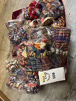 Bulk bags of multicoloured worry dolls in box