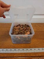 Open container showing quantity of pennies