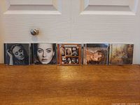 Front view of all five CD cases lined up