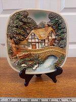 Front view of chalkware plaque on stand