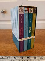 Four books in slipcase, spine view