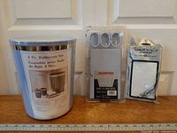 Three packaged items: 4-piece accessory set, magnetic shower curtain with hooks, vinyl liner