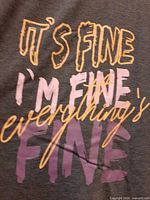 Back of T-shirt showing multicolour graphic text