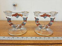 Pair of heart-shaped double candle holders with ruler for scale