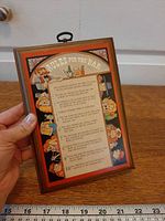 Front view showing full plaque design and scale