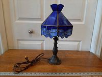 Full lamp with cord and ruler for scale