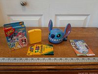 All five items arranged with ruler for scale