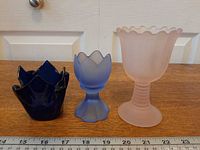 All three candle holders with ruler for scale