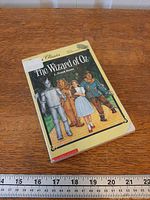 Front cover showing title, author, characters, wear on corners