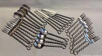 All 29 twisted handle flatware pieces laid out