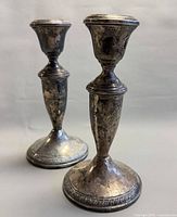 Pair of weighted sterling candlesticks front view