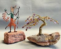 Both figurines side by side to show overall design and scale