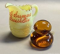 Front view of creamer and bird together