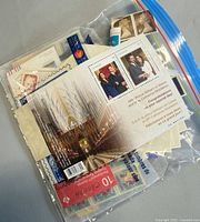 Zip bag containing mixed Canadian stamps and Royal Wedding souvenir sheet