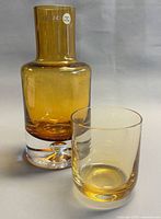 Decanter and tumbler front view showing color and size