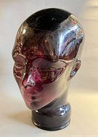 Front view of purple glass mannequin head