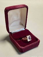 Ring in burgundy presentation box showing overall design