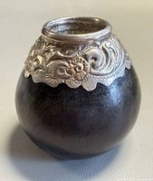 Full view of gourd showing silver and gold collar