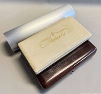 Three cases: Parker 61 box, hardwood pen case, aluminum pen tube
