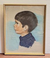 Full view of framed pastel portrait in gold-tone frame