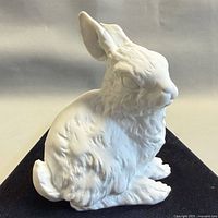 Front left view of white porcelain rabbit figurine